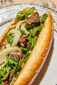 Stewed beef sandwich with parsley and onions