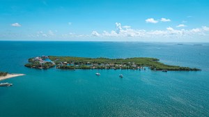 The property occupies the northern tip of Placencia Caye, five minutes via boat from the mainland. Opposite page, top left: Suites are positioned for views of the Caribbean.