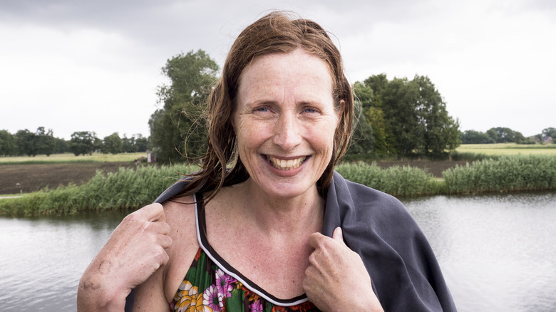 A woman in her 50s after a swim in a lake