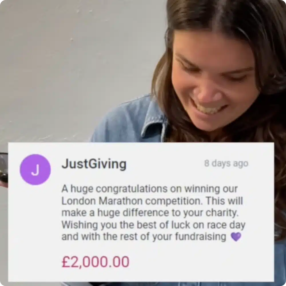 An image showing a JustGiving staff member calling a London Marathon fundraising incentive winner to congratulate them on winning a £2,000 donation to the cause they fundraised for on JustGiving.