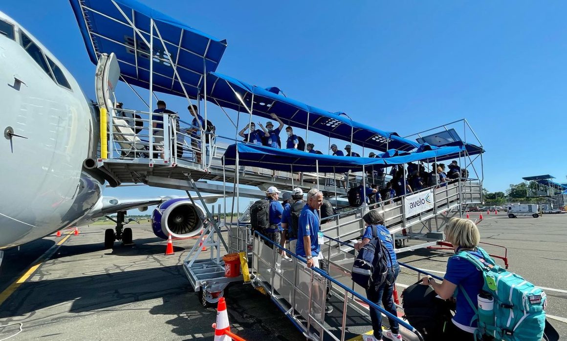 Passengers board an Avelo Airlines flight at HVN