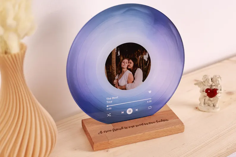 blue vinyl record with wooden base