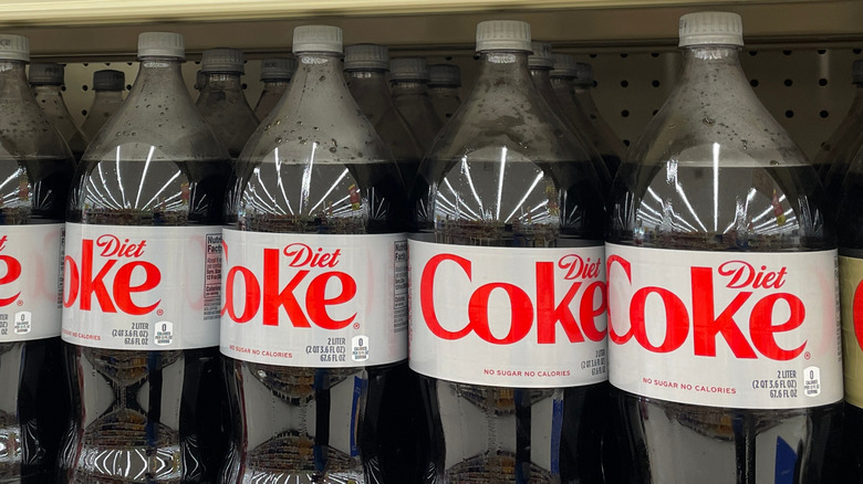 A grocery store shelf of 2-liter bottles of Diet Coke