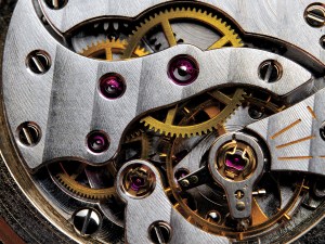 The gear train of a mid-20th-century Swiss watch, made before companies began turning to factories abroad.