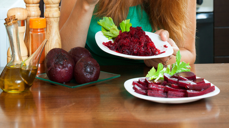 woman eating a plate full of beets