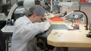 A watchmaker at Stoll & Co. grades a timepiece for TGS