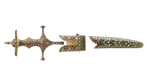 An 18th-century enameled sword hilt and scabbard cover.