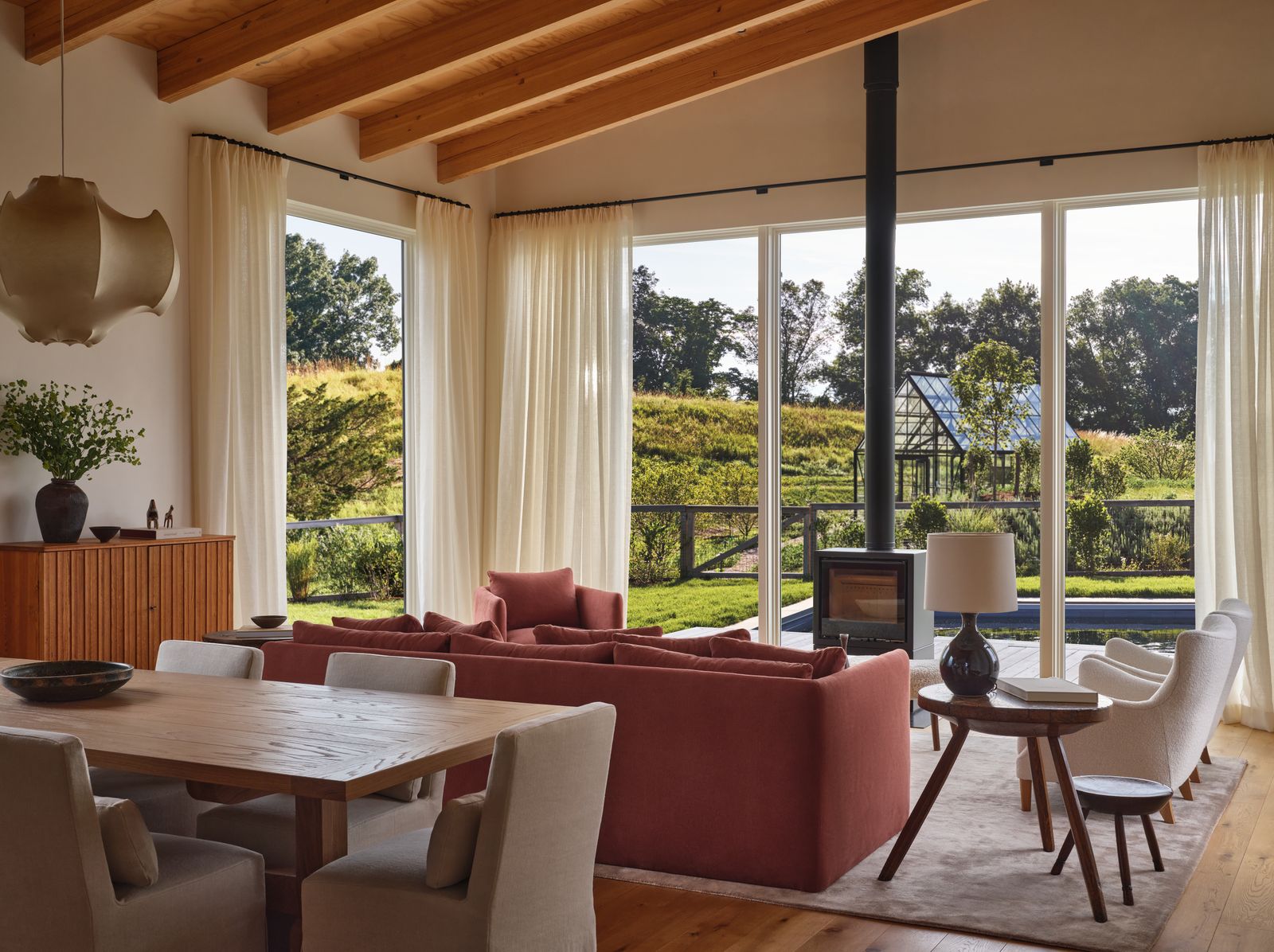 Image may contain Indoors Interior Design Lamp Plant Book Publication Chair Furniture Table and Architecture