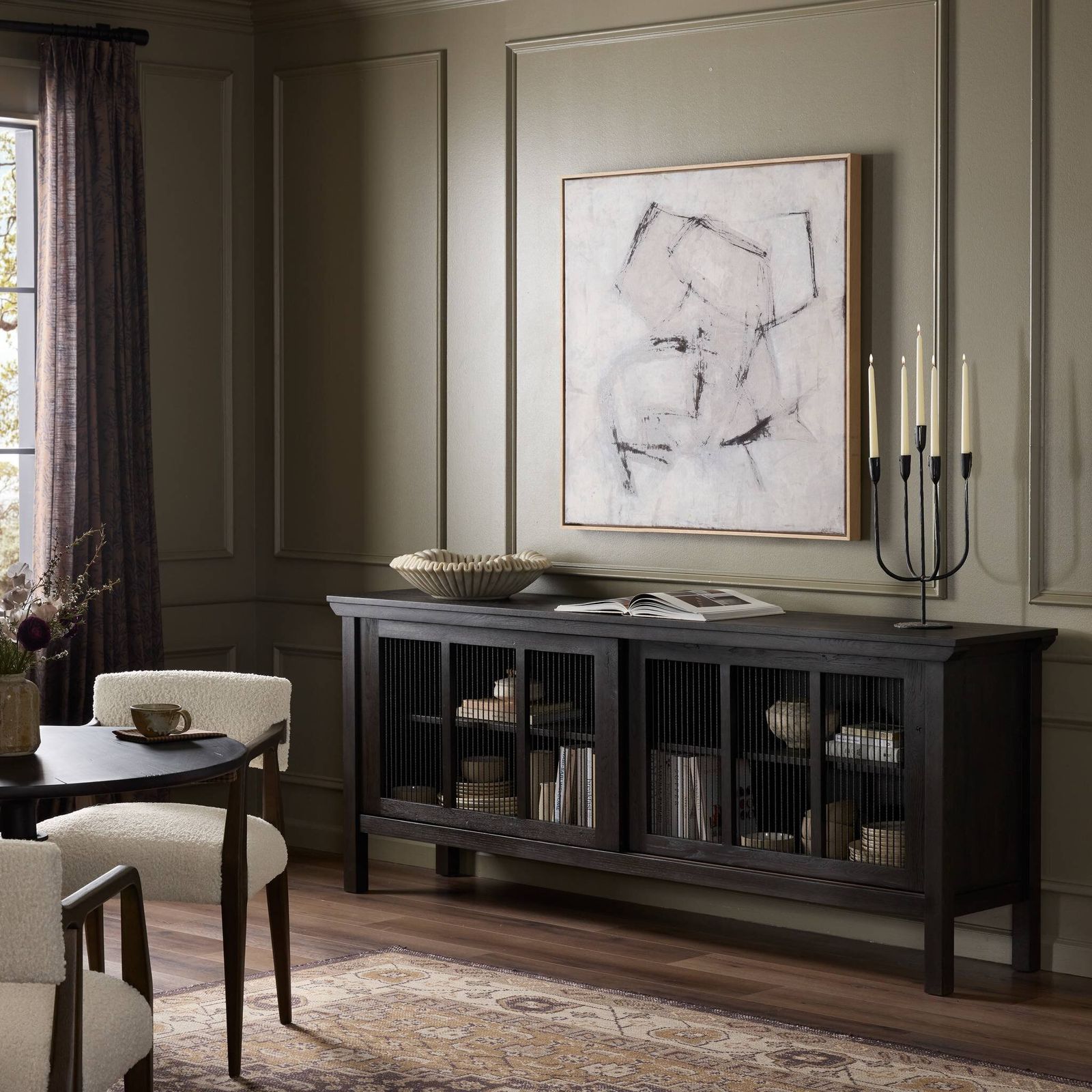 Image may contain Furniture Sideboard Book Publication Indoors Interior Design Chair Home Decor Rug and Art