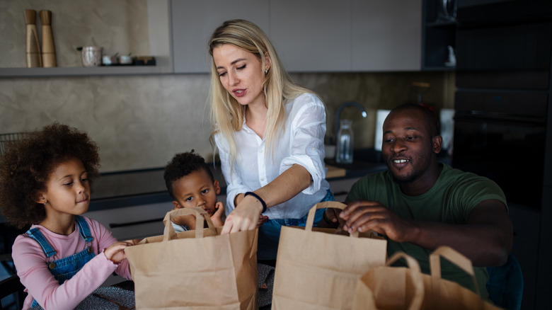 family getting ready to eat takeout food