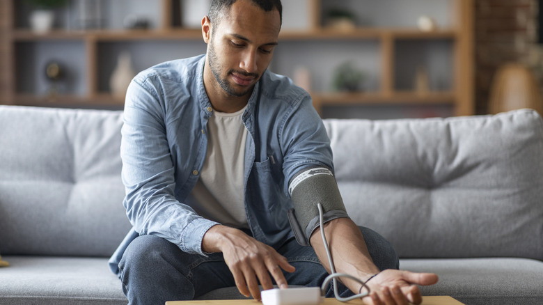 man checking his blood pressure