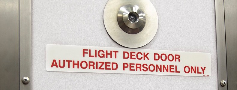 Sign on a cockpit door saying authorized personnel only