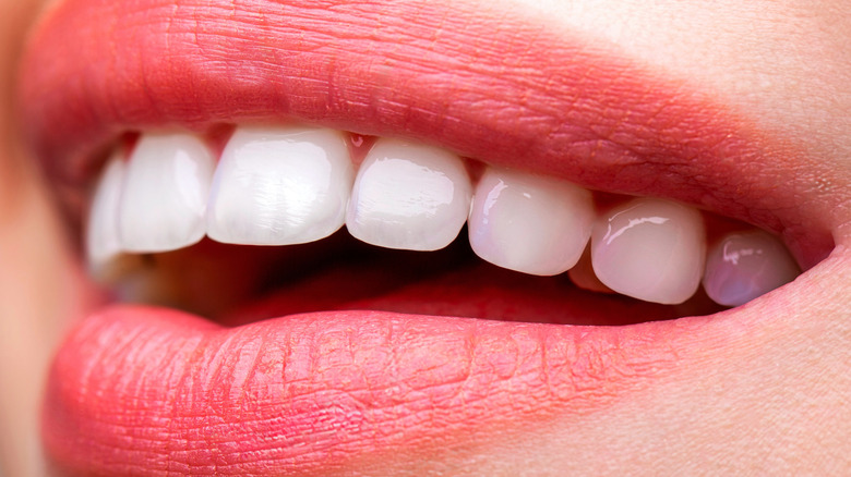 A close-up shot of lips and teeth