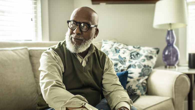 older man sitting on sofa