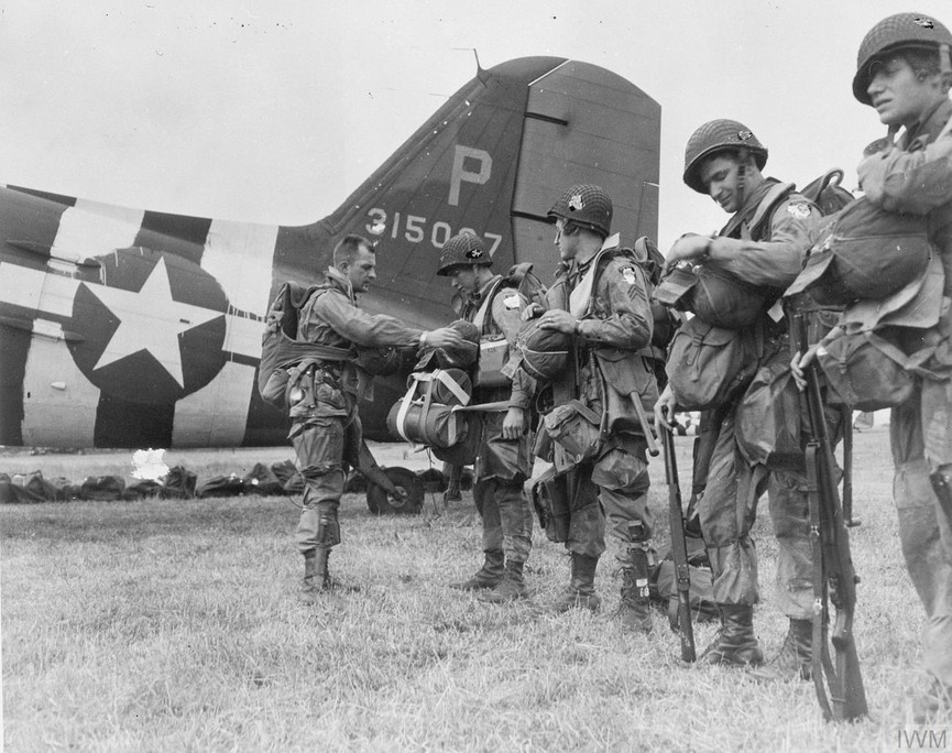 American D-Day paratroopers checking their kits before setting off for France