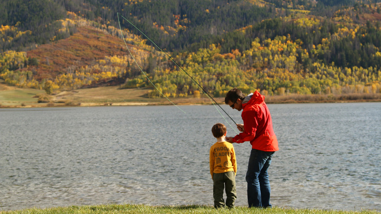 A man fishing with his son in Steamboat Springs, Colorado
