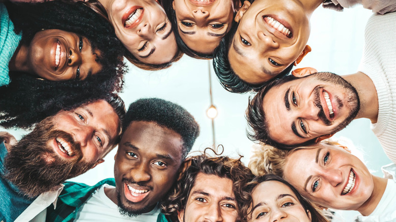 many men and women looking at camera from above