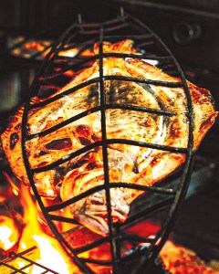 Chicago’s Asador Bastian offers a whole grilled turbot with a garlicky sauce.